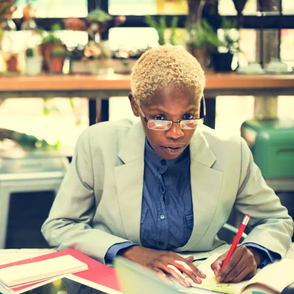 african-businesswoman-writing-paperwork-planning-s-2025-02-09-22-57-37-utc-69319177bb794