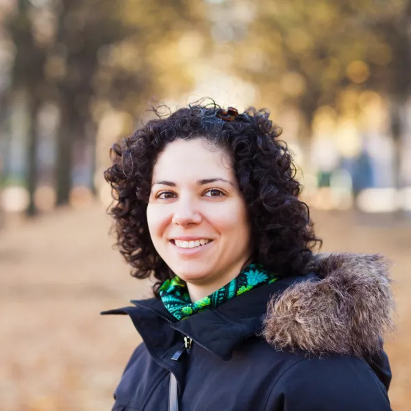 portrait-of-happy-woman-with-curly-hair-at-park-2024-10-18-04-16-23-utc-69318fa0b1a6d